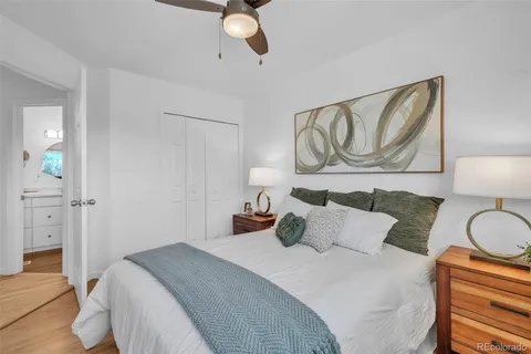 a bedroom with a bed and cabinets