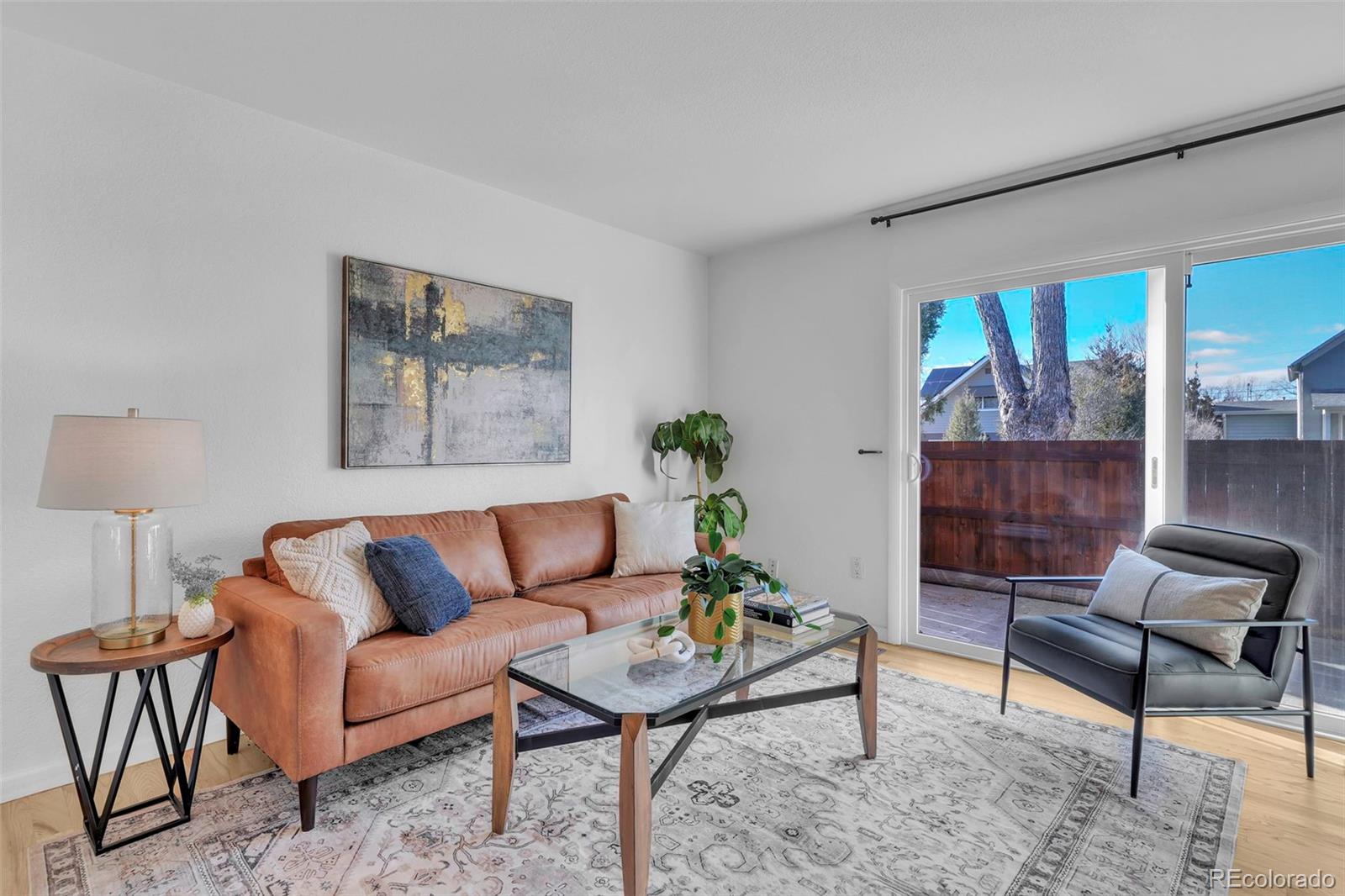 2808 Eaton Street Wheat Ridge, CO 80214 - Photo 2 of 36 a living room with furniture potted plant and a window