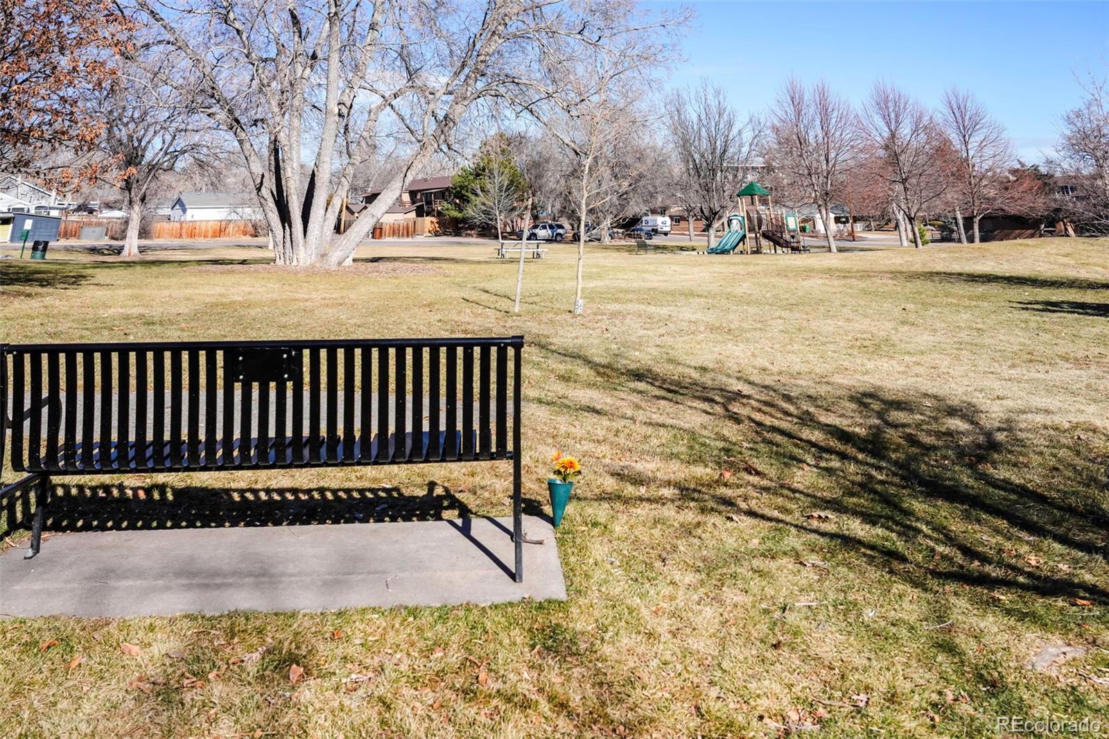 2808 Eaton Street Wheat Ridge, CO 80214 - Photo 27 of 36 a view of a yard with wooden fence and trees