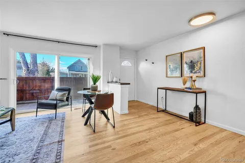 a living room with furniture a window and a table