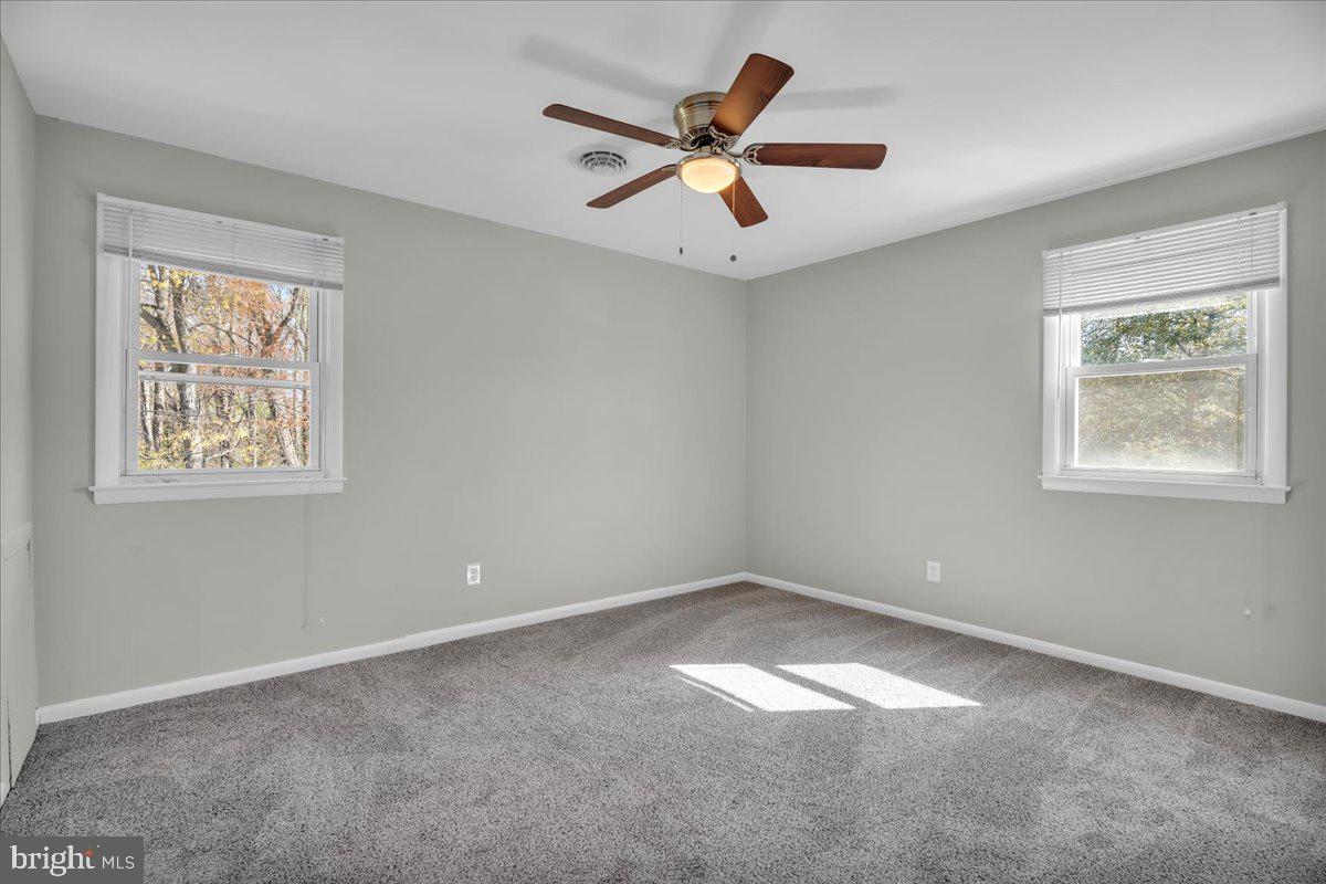 301 County House Road Sewell, NJ 08080 - Photo 12 of 23 a view of a big room with a ceiling fan and windows