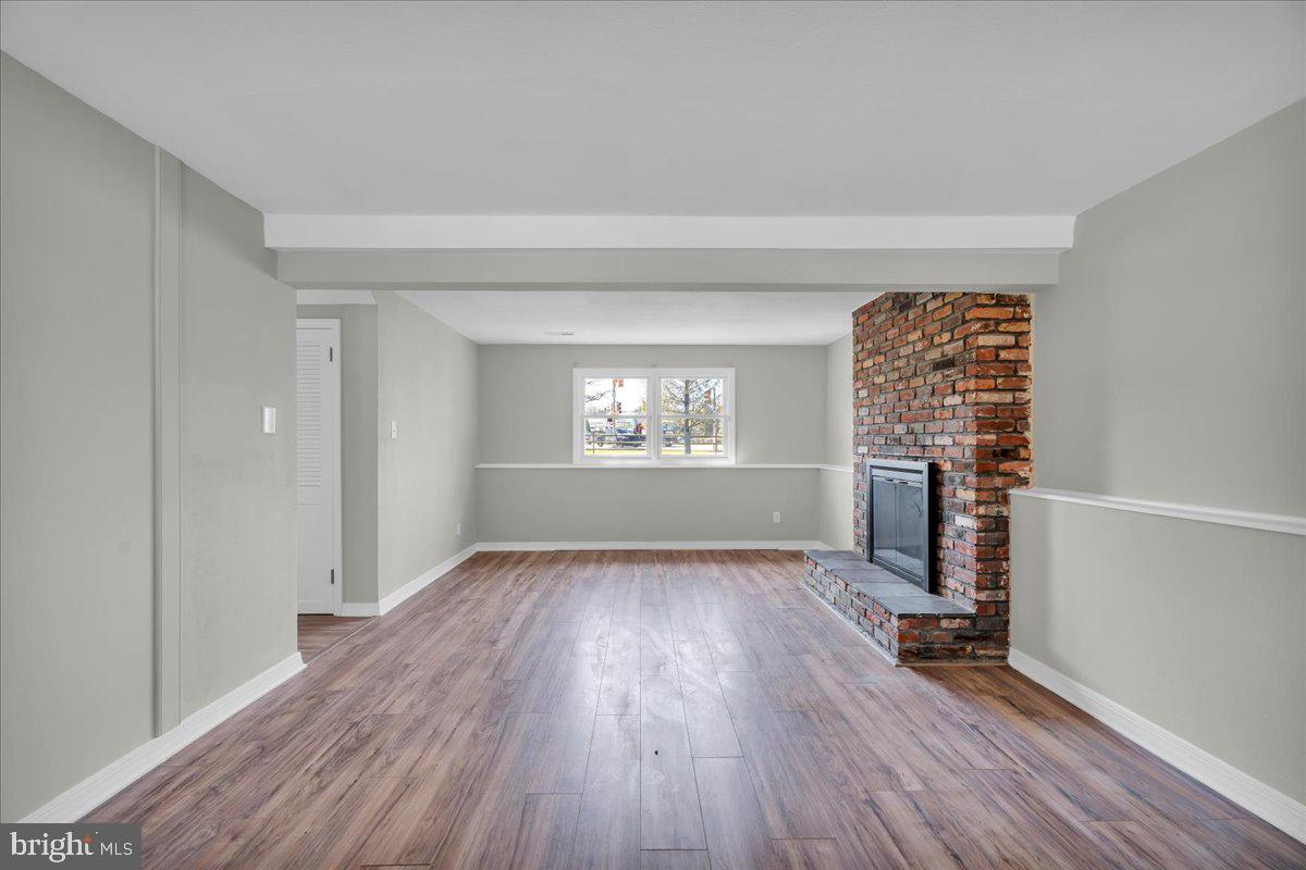 301 County House Road Sewell, NJ 08080 - Photo 14 of 23 wooden floor in an empty room with a window