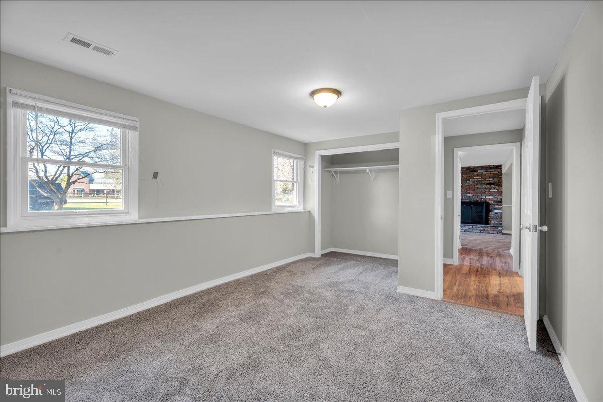 301 County House Road Sewell, NJ 08080 - Photo 19 of 23 an empty room with windows