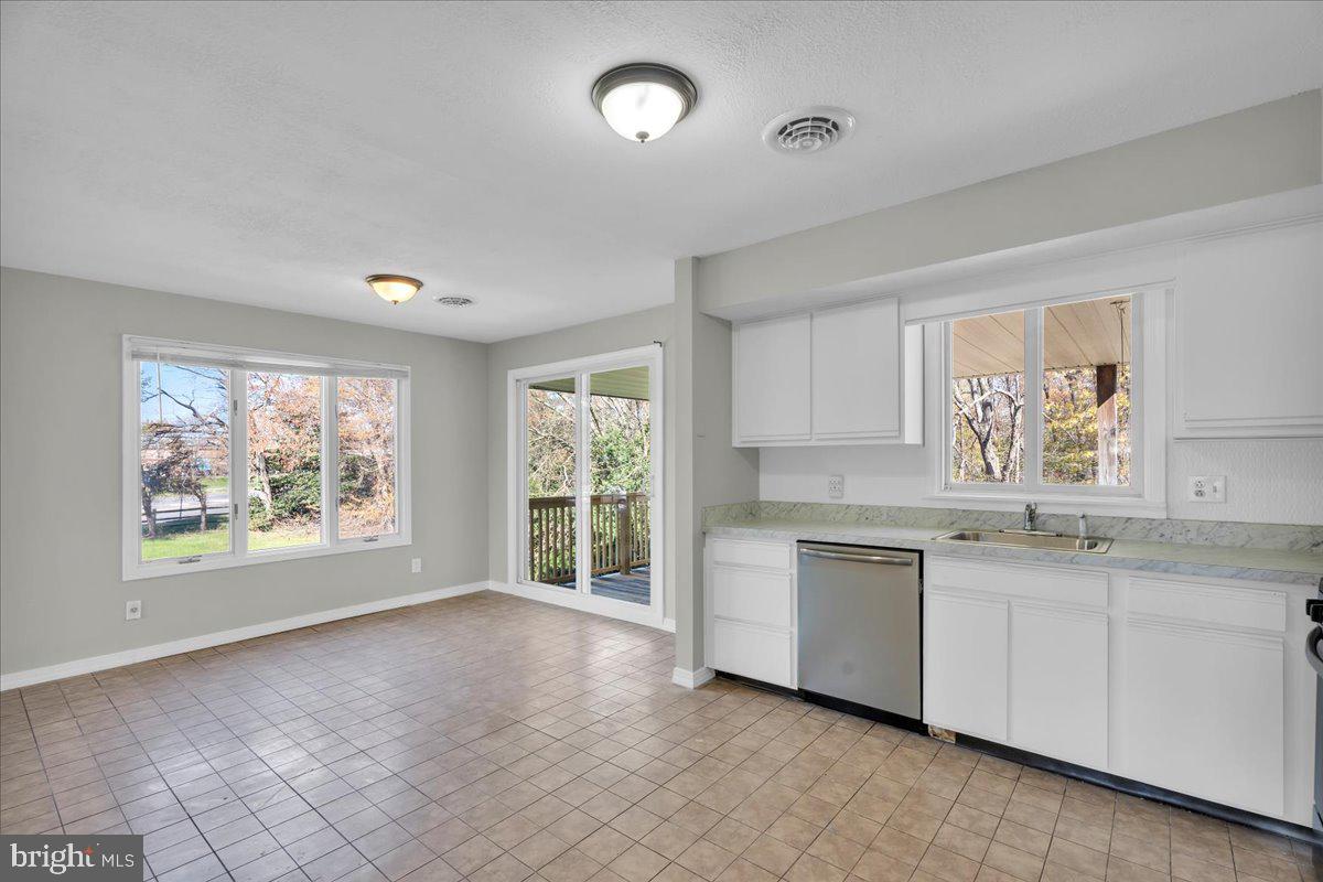 301 County House Road Sewell, NJ 08080 - Photo 9 of 23 a view of a kitchen sink and dishwasher with wooden floor