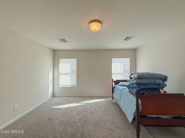 a living room with a couch and a window