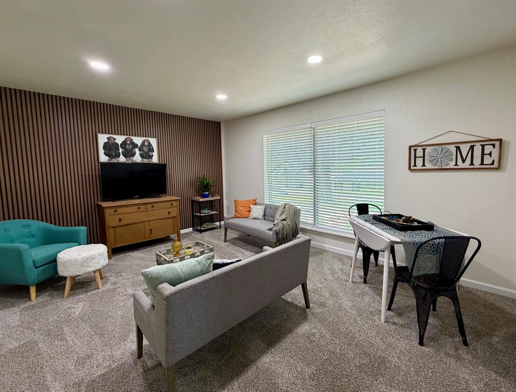 3609 Country Club Road Arlington, TX 76013 - Photo 16 of 40 a living room with furniture and a flat screen tv