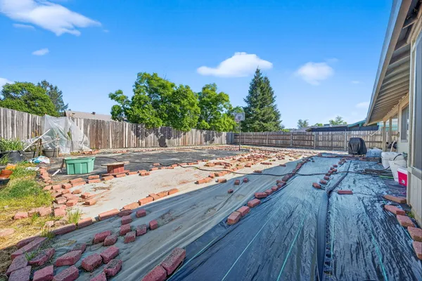 a view of a backyard of the house