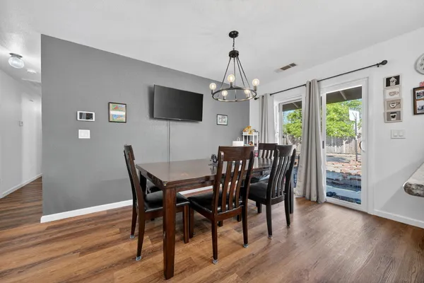 a view of a dining room with furniture window and wooden floor