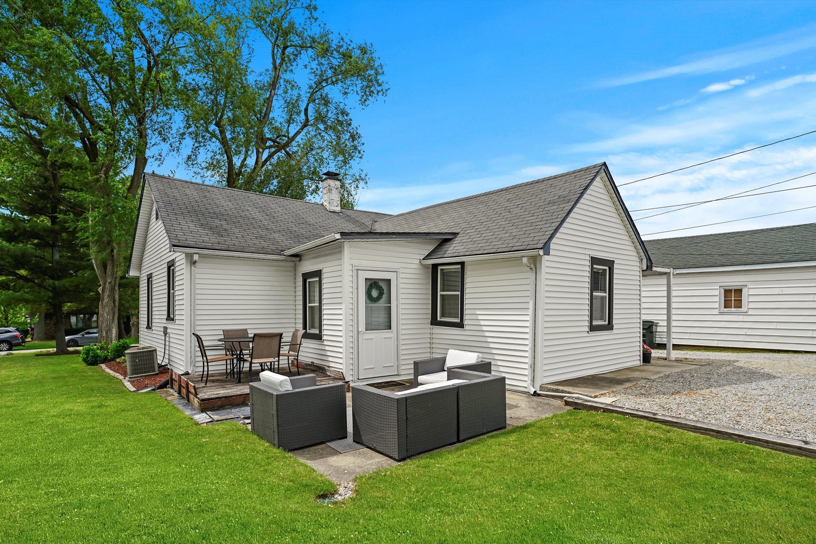 635 Birch Drive Beecher, IL 60401 - Photo 12 of 14 a backyard of a house with table and chairs