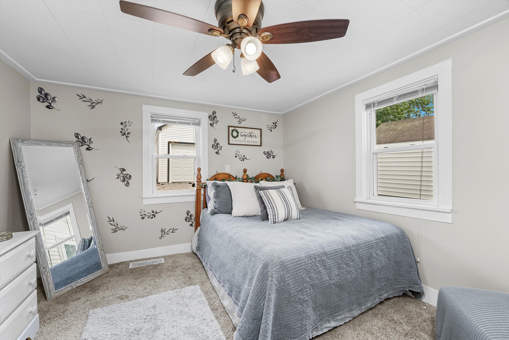 635 Birch Drive Beecher, IL 60401 - Photo 7 of 14 a bed room with a bed a window and a chandelier