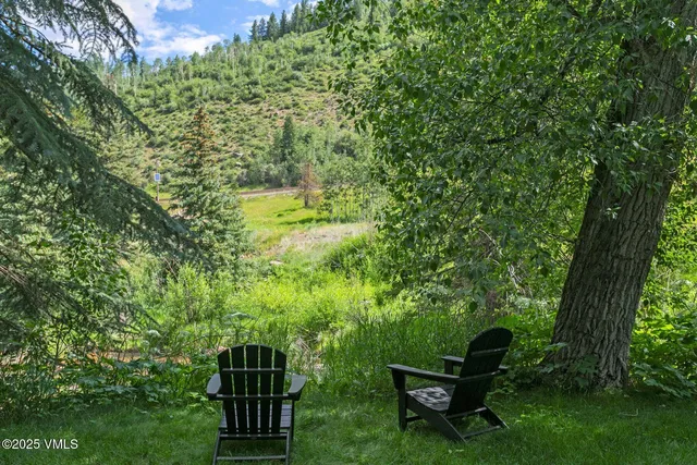 a view of a bench in a garden