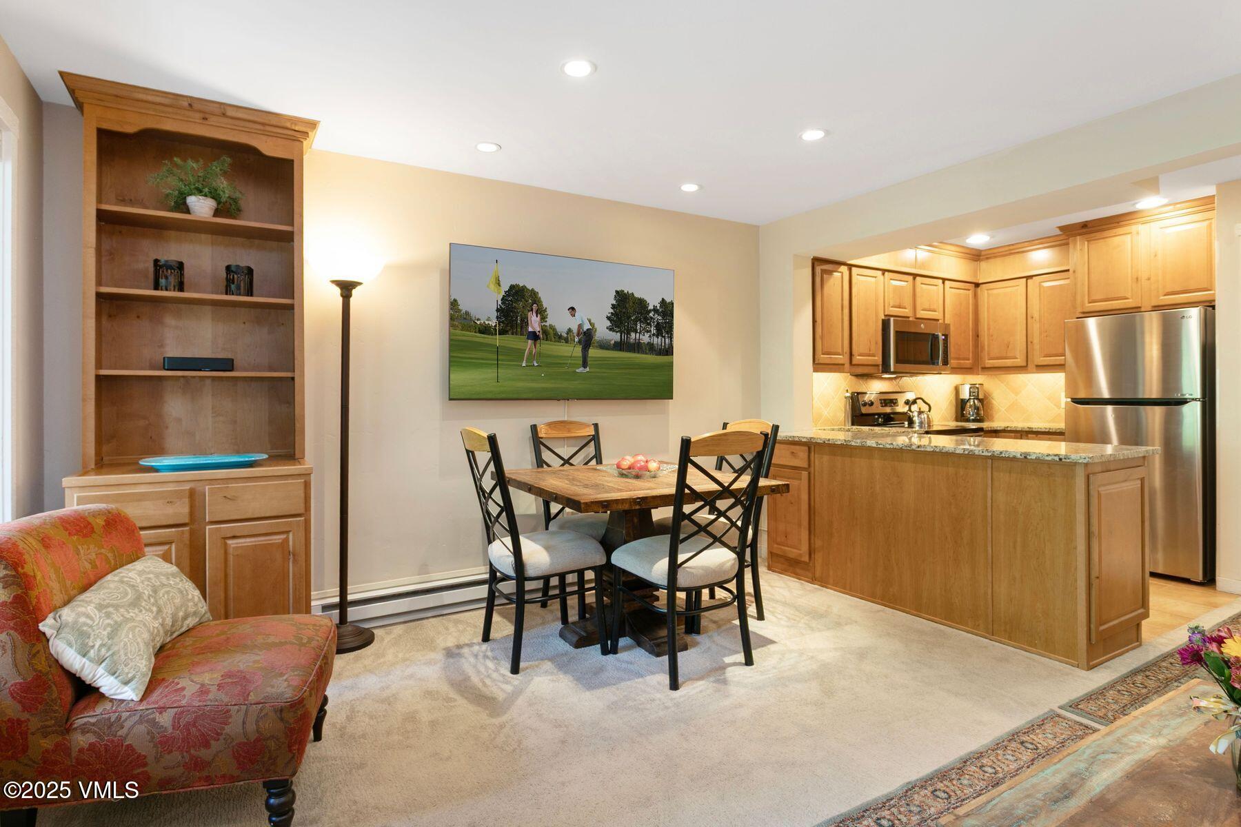 4610 Vail Racquet Club Drive, Unit 2 Vail, CO 81657 - Photo 4 of 28 a view of a dining room with furniture and chandelier