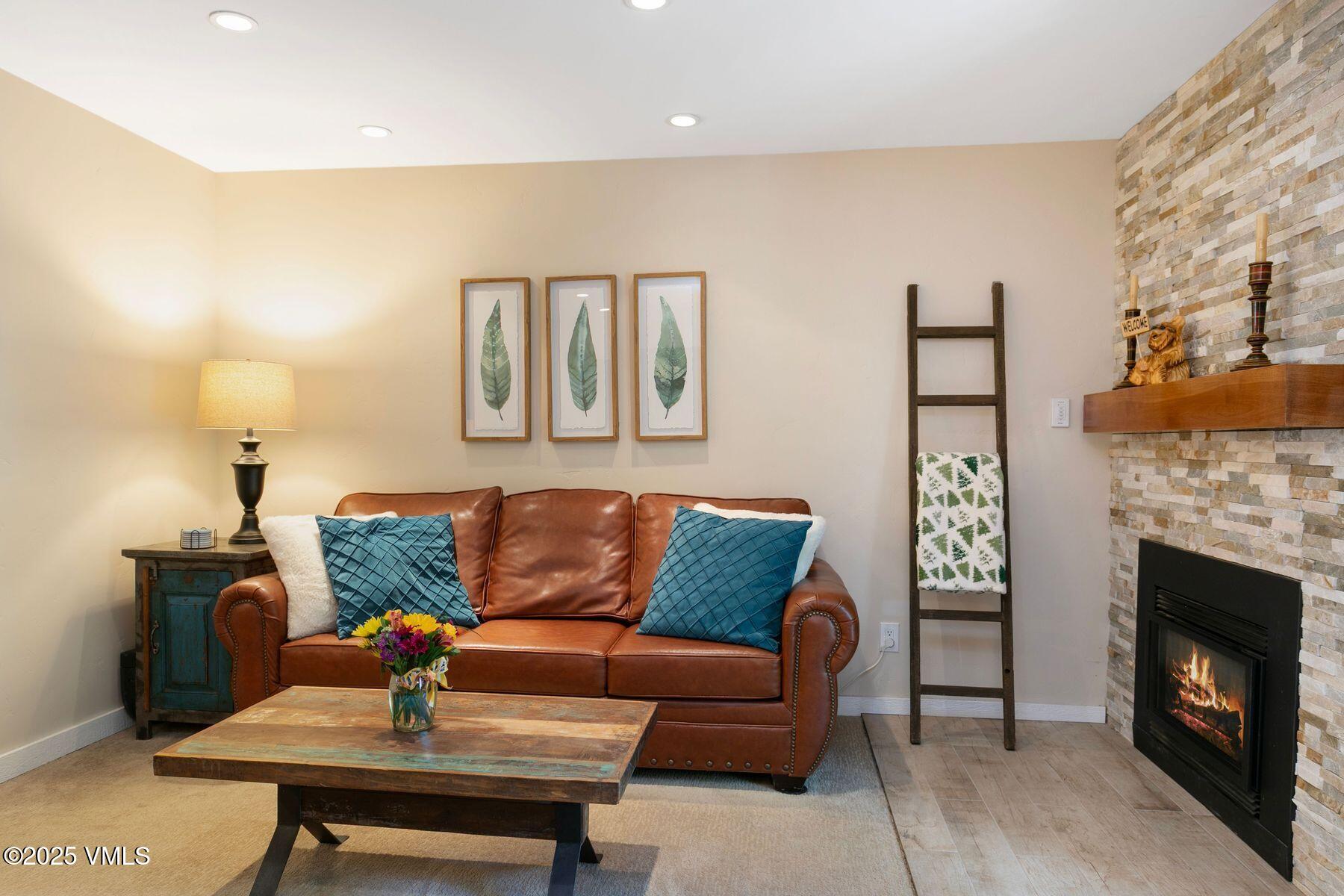 4610 Vail Racquet Club Drive, Unit 2 Vail, CO 81657 - Photo 7 of 28 a living room with furniture and a fireplace