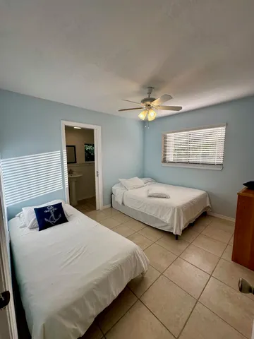 a bathroom with a sink a mirror and a shower