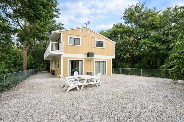 a kitchen with a sink a stove and cabinets