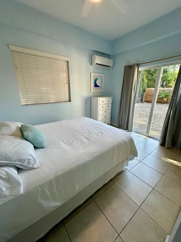 a bathroom with a sink a toilet a mirror and shower