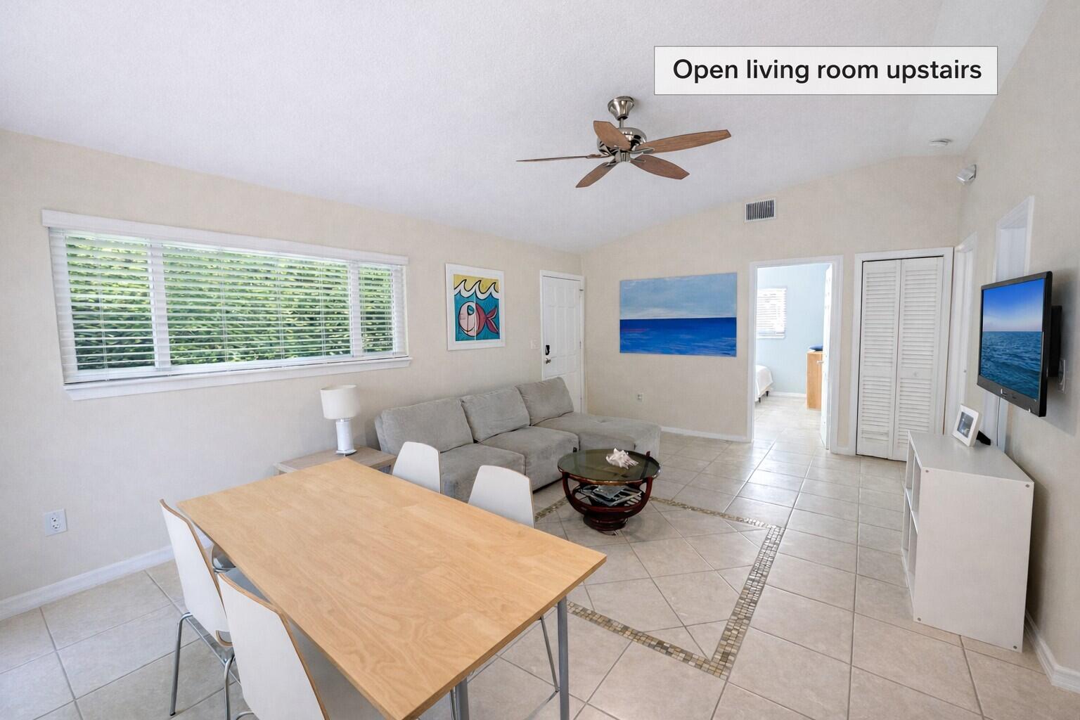 335 Bayview Avenue Key Largo, FL 33037 - Photo 4 of 57 a living room with furniture and a flat screen tv