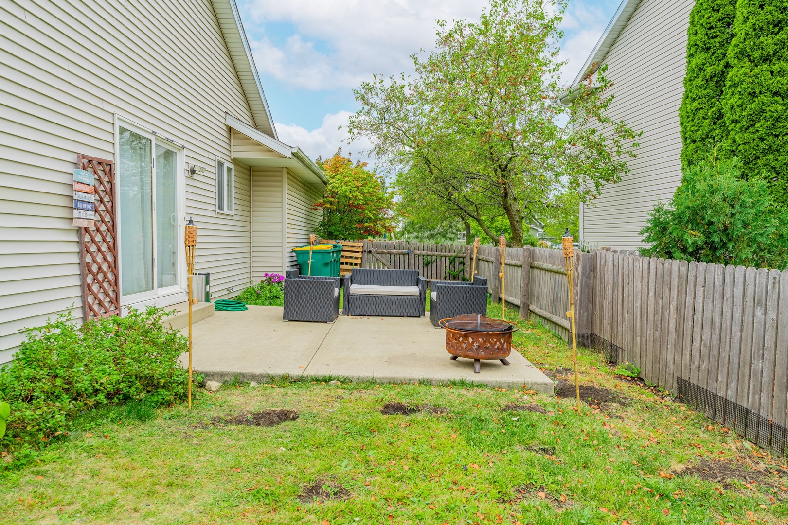 2008 Gray Hawk Court Plainfield, IL 60586 - Photo 21 of 23 a view of a backyard with couches plants and large tree