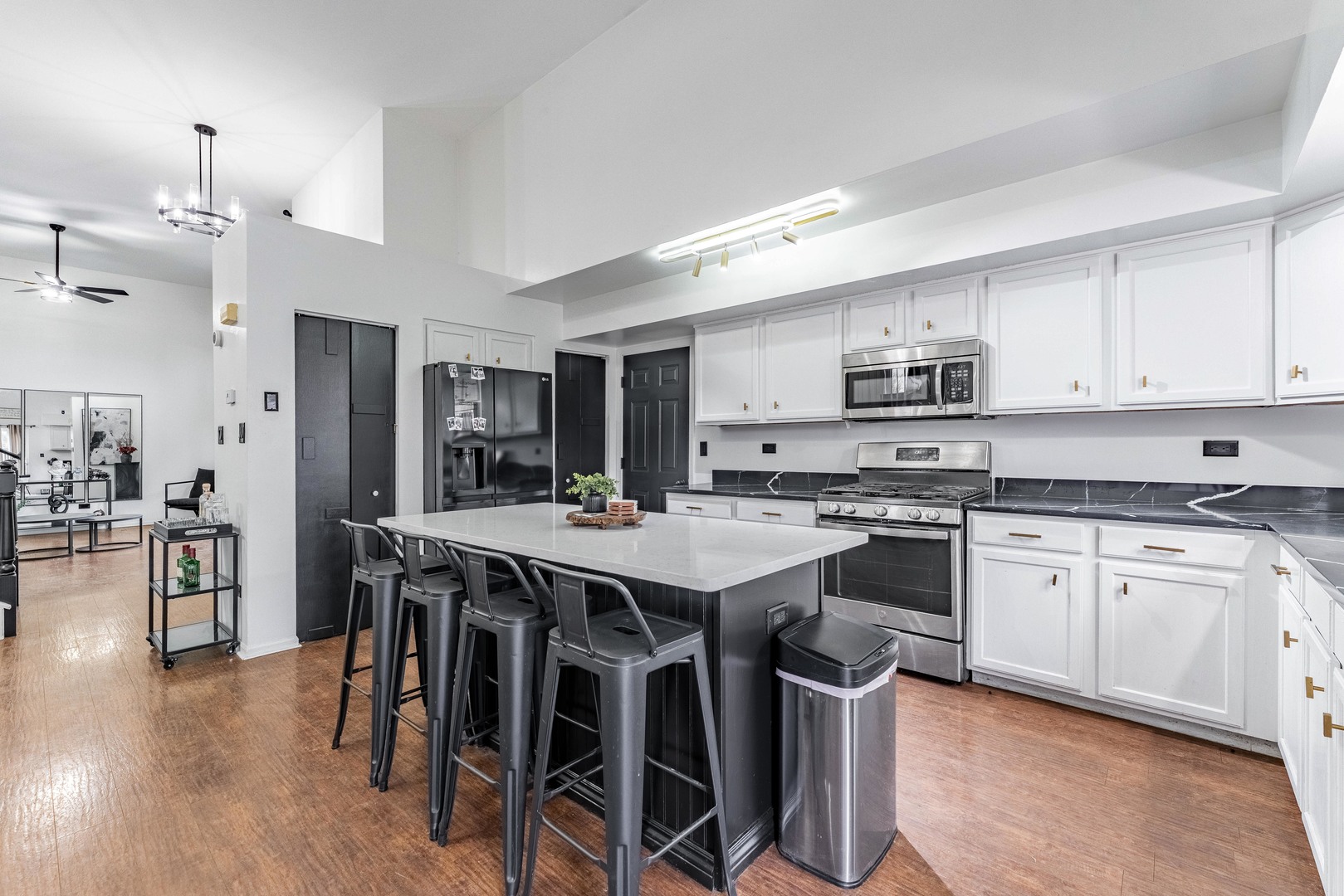 2008 Gray Hawk Court Plainfield, IL 60586 - Photo 8 of 23 a kitchen with stainless steel appliances granite countertop a stove a sink dishwasher a stove a refrigerator a dining table and chairs with wooden floor