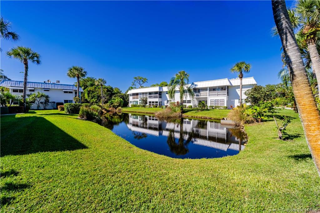 2929 Southeast Ocean Boulevard, Unit K1 Stuart, FL 34996 - Photo 17 of 26 a view of a house with a swimming pool
