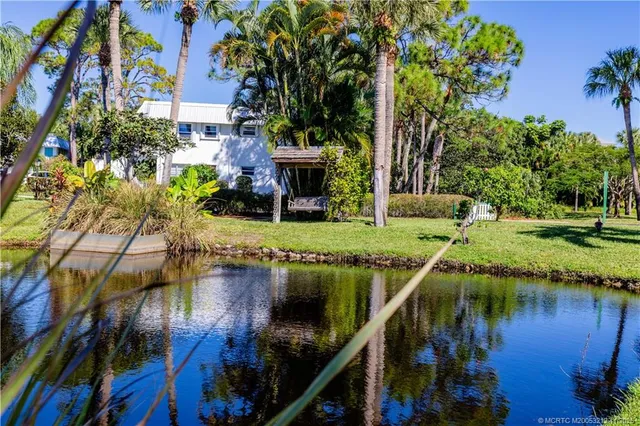 a view of house with a yard