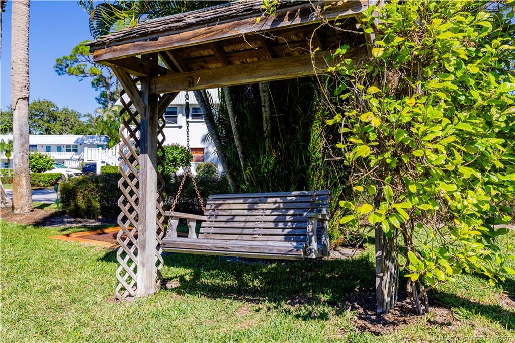 2929 Southeast Ocean Boulevard, Unit K1 Stuart, FL 34996 - Photo 20 of 26 a view of house with a yard