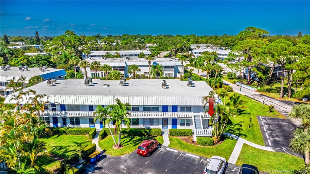 2929 Southeast Ocean Boulevard, Unit K1 Stuart, FL 34996 - Photo 2 of 26 a aerial view of multiple houses with yard