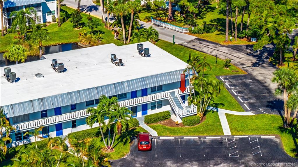 2929 Southeast Ocean Boulevard, Unit K1 Stuart, FL 34996 - Photo 22 of 26 a view of a swimming pool with a patio