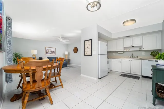 a view of kitchen with cabinets and outdoor space