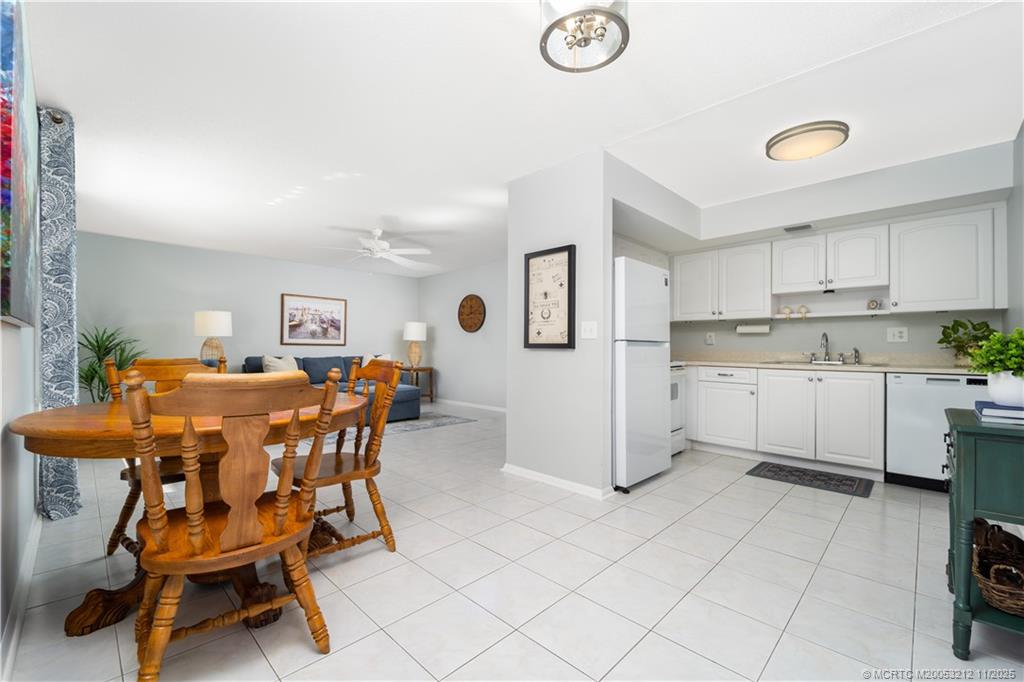2929 Southeast Ocean Boulevard, Unit K1 Stuart, FL 34996 - Photo 7 of 26 a view of kitchen with cabinets and outdoor space