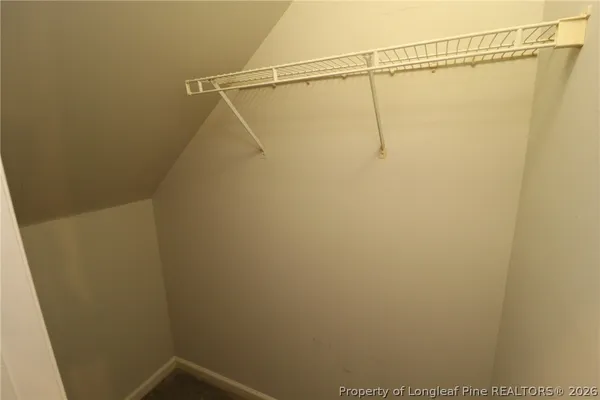 a white toilet sitting next to a shower