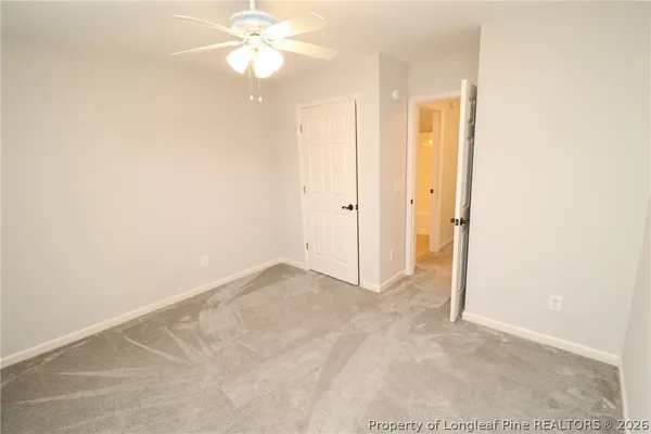 a white toilet sitting next to a bath tub