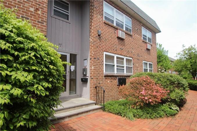 637 Cove Road, Unit D15 Stamford, CT 06902 - Photo 1 of 1 a front view of a house with a yard