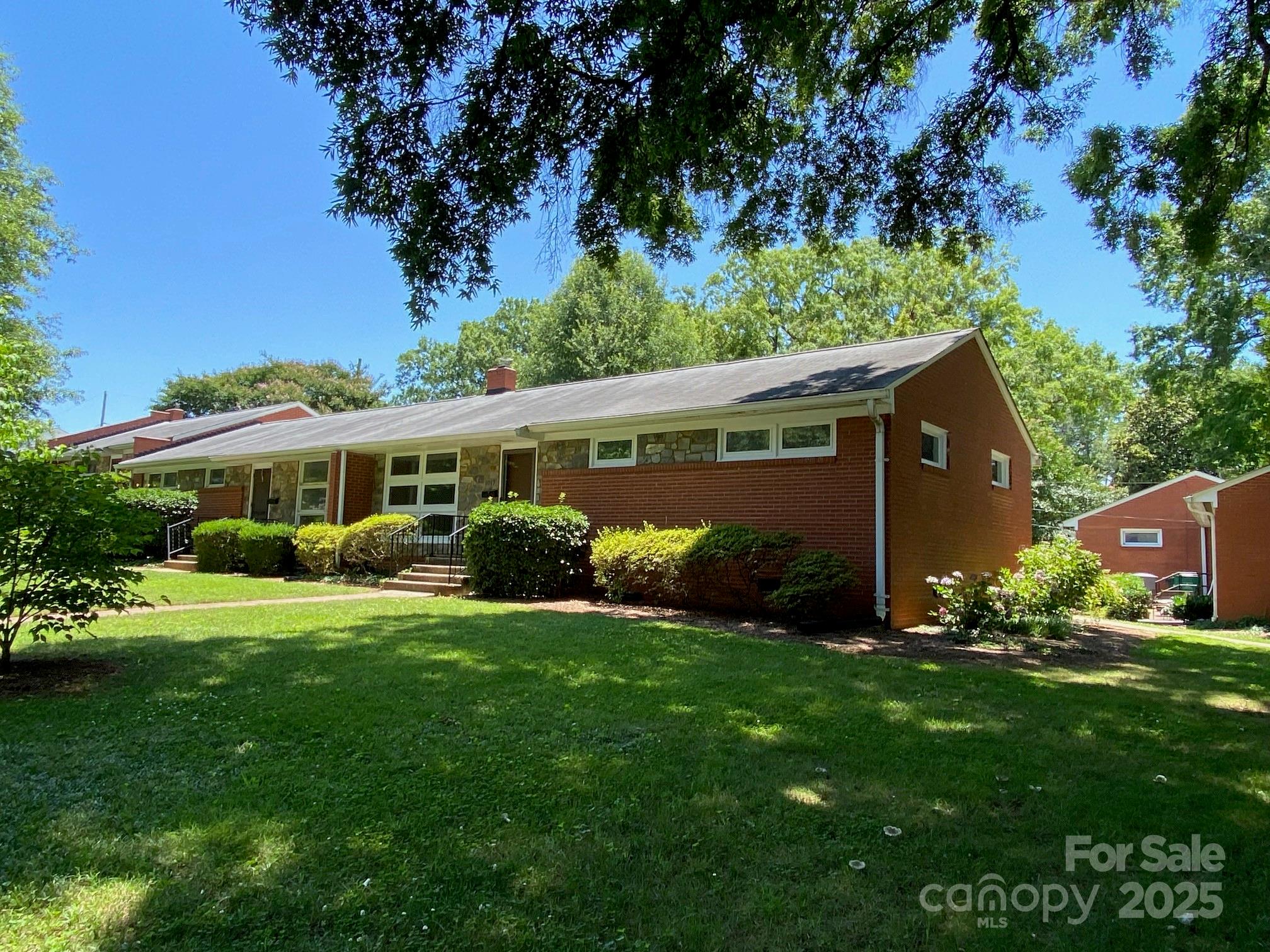 1017 Andover Road Charlotte, NC 28211 - Photo 1 of 20 a front view of house with a garden