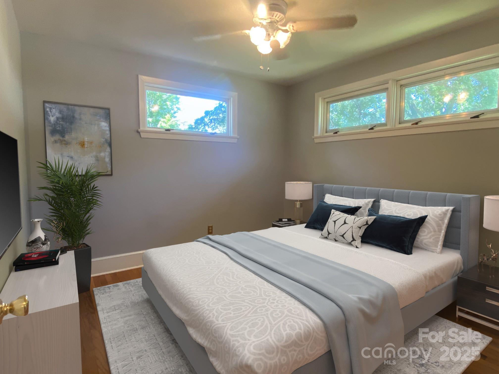 1017 Andover Road Charlotte, NC 28211 - Photo 11 of 20 a bedroom with bed and a potted plant