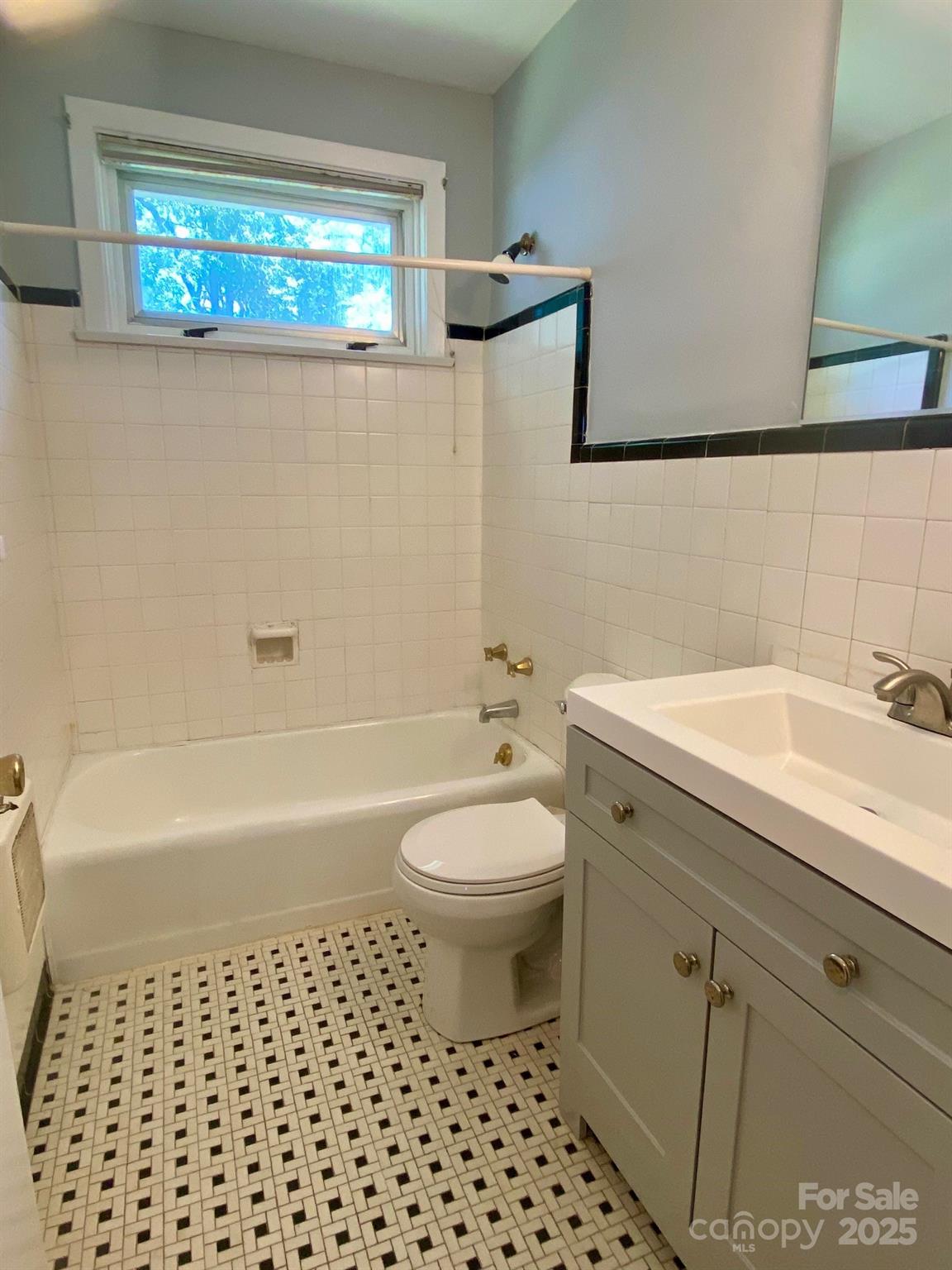 1017 Andover Road Charlotte, NC 28211 - Photo 16 of 20 a bathroom with a sink a toilet and shower