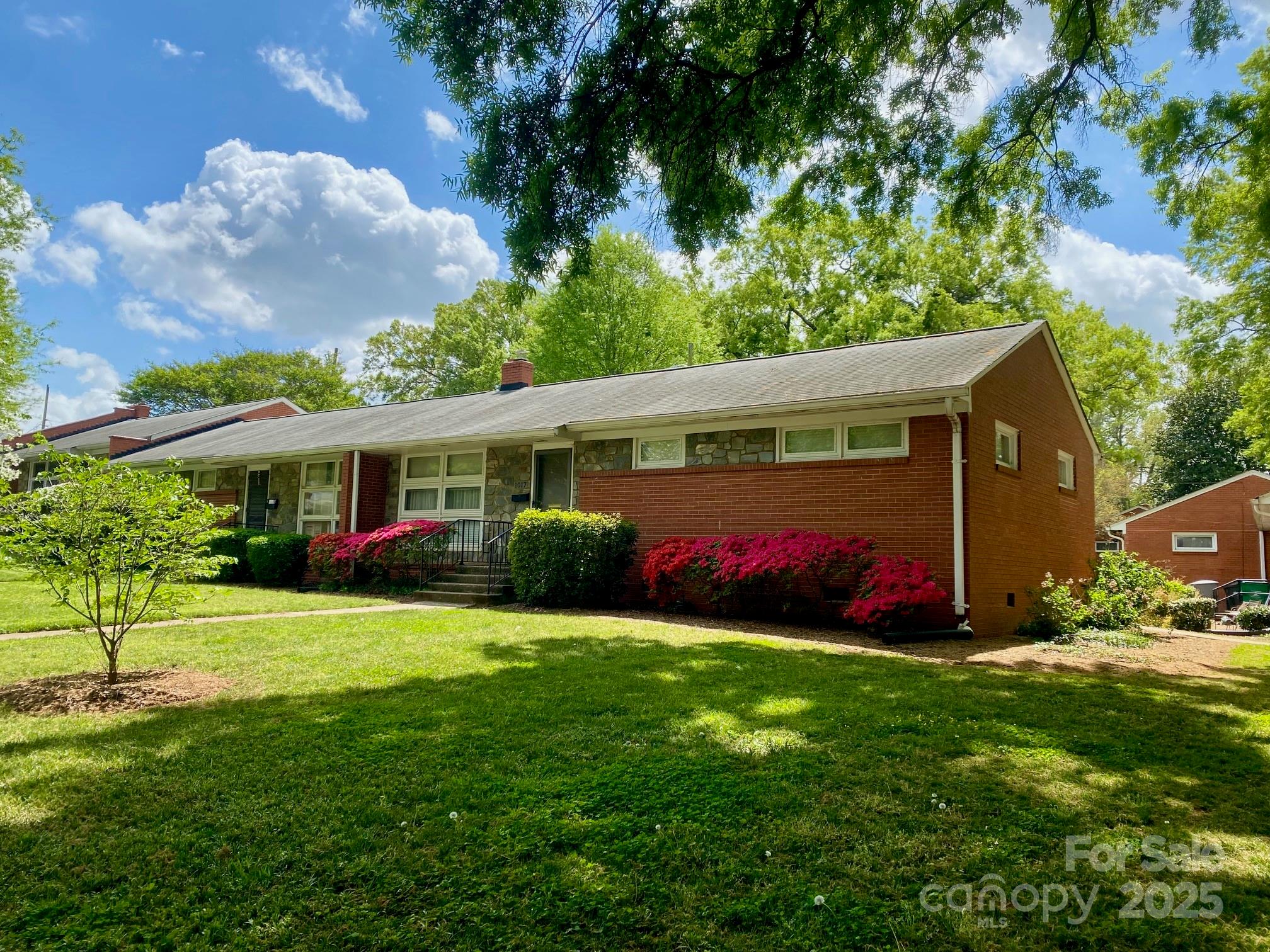1017 Andover Road Charlotte, NC 28211 - Photo 19 of 20 a view of a house with a big yard and potted plants