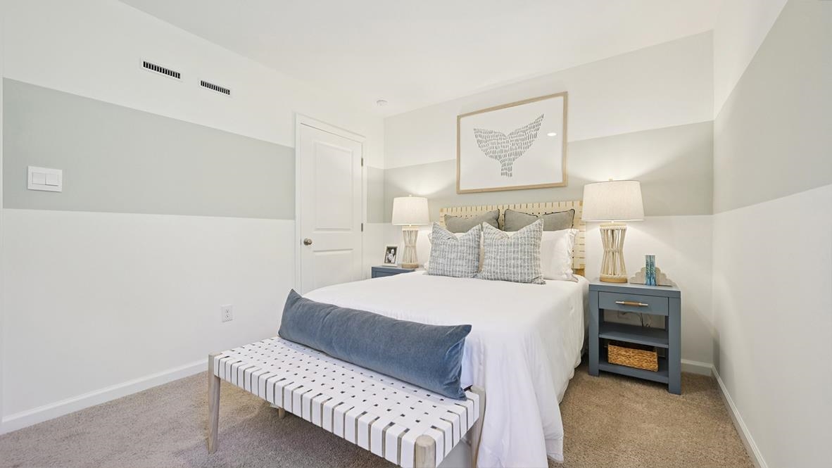 501 Scotty, Unit 1304 Rio Grande, NJ 08242 - Photo 27 of 41 a bedroom with a bed and a lamp