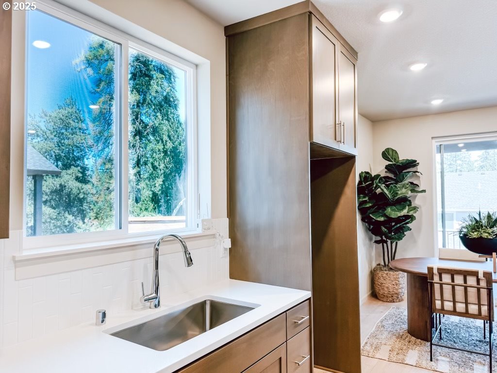 2607 South 6th Way Ridgefield, WA 98642 - Photo 14 of 32 a kitchen with a refrigerator and a sink