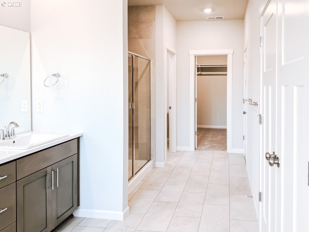2607 South 6th Way Ridgefield, WA 98642 - Photo 29 of 32 a bathroom with a sink and a mirror