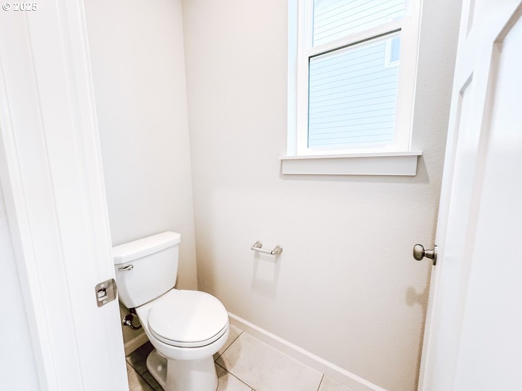 2607 South 6th Way Ridgefield, WA 98642 - Photo 31 of 32 a white toilet sitting next to a white cabinet