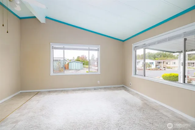 a view of an empty room with a window