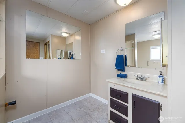 a bathroom with a tub and window