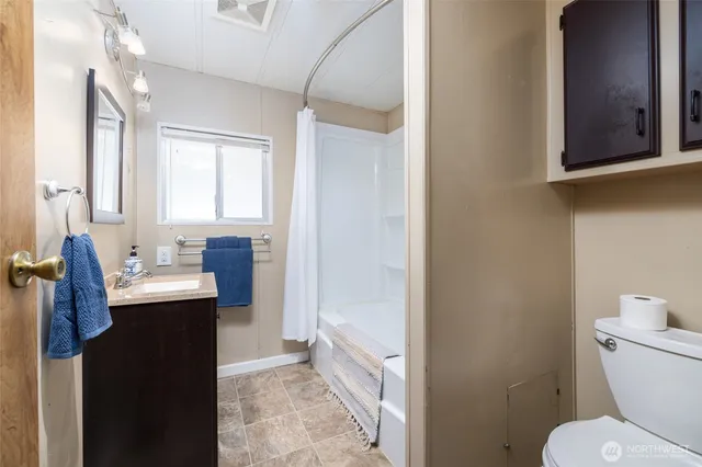 a utility room with closet dryer and washer