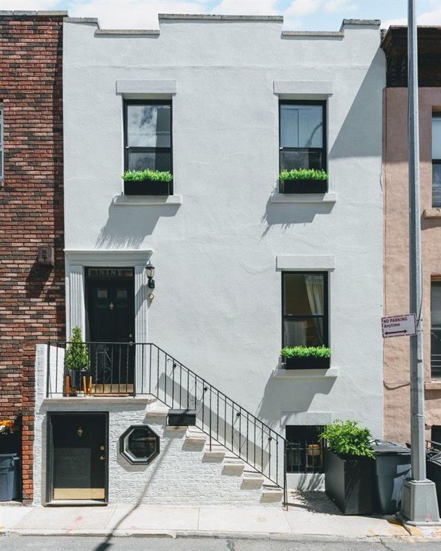 a front view of a house with yard