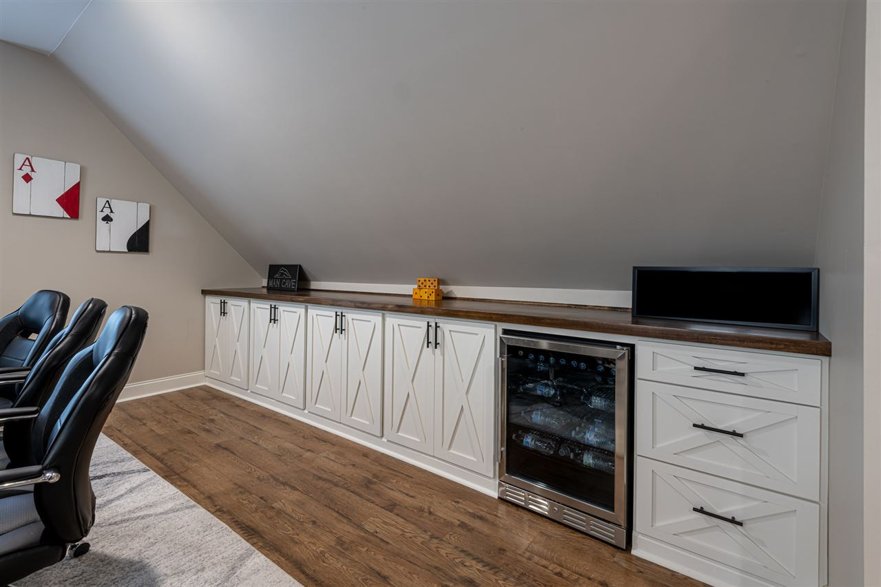 2916 SnapsWell Street Raleigh, NC 27614 - Photo 21 of 30 Beautiful Custom Built Bank of Cabinetry Space for Crafts, Games, Toys and/or Work Out Equipment ! Boasts of a Gorgeous Solid Wood Top finished to Perfection with Impressive Hardware. Bonus Room Custom Cabinetry