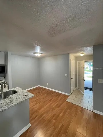 a view of a livingroom with a kitchen