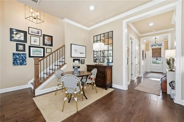 a view of a livingroom with furniture staircase and a living room