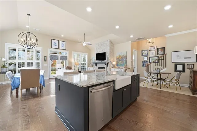 a kitchen with center island table and chairs