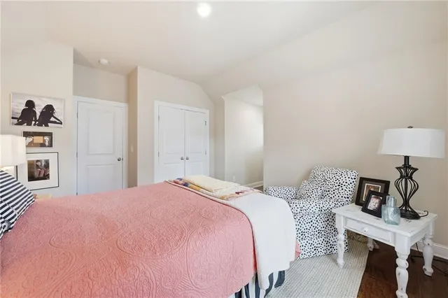 a bedroom with a bed and a table in it